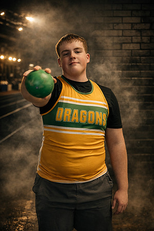 Athlete with shot put in focus
